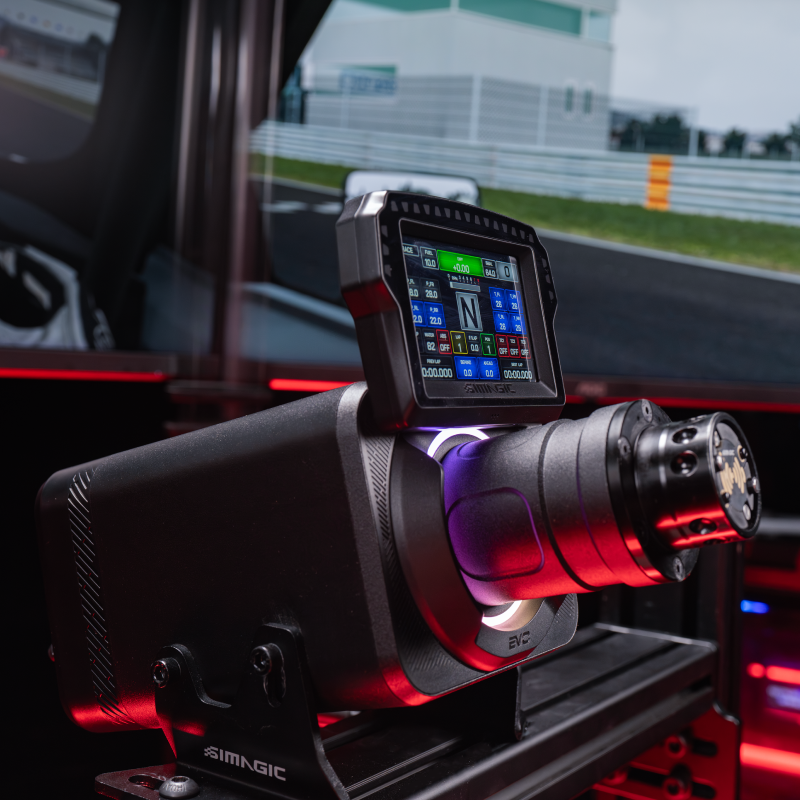 Simagic MagicDash 4 powered on, mounted on an Alpha EVO wheelbase in a triple-monitor sim racing cockpit