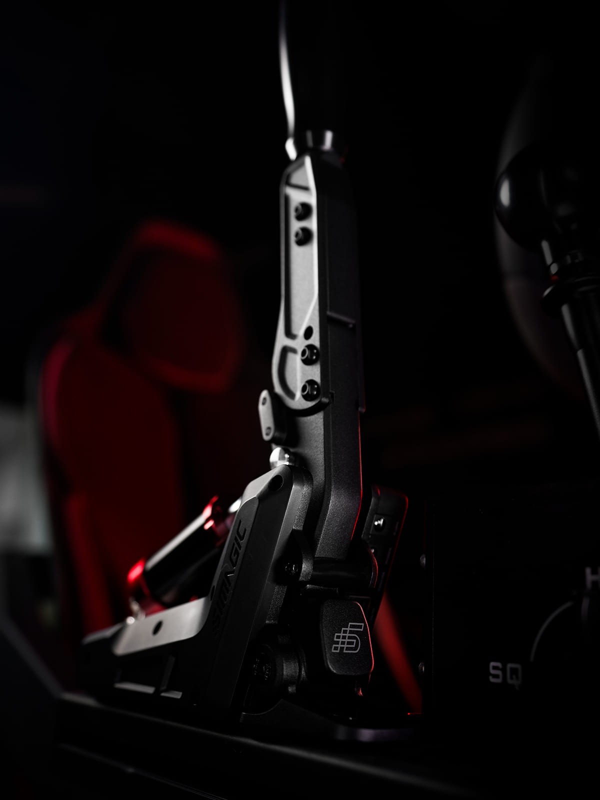 Close up Simagic TB-Neo handbrake mounted to a sim racing cockpit